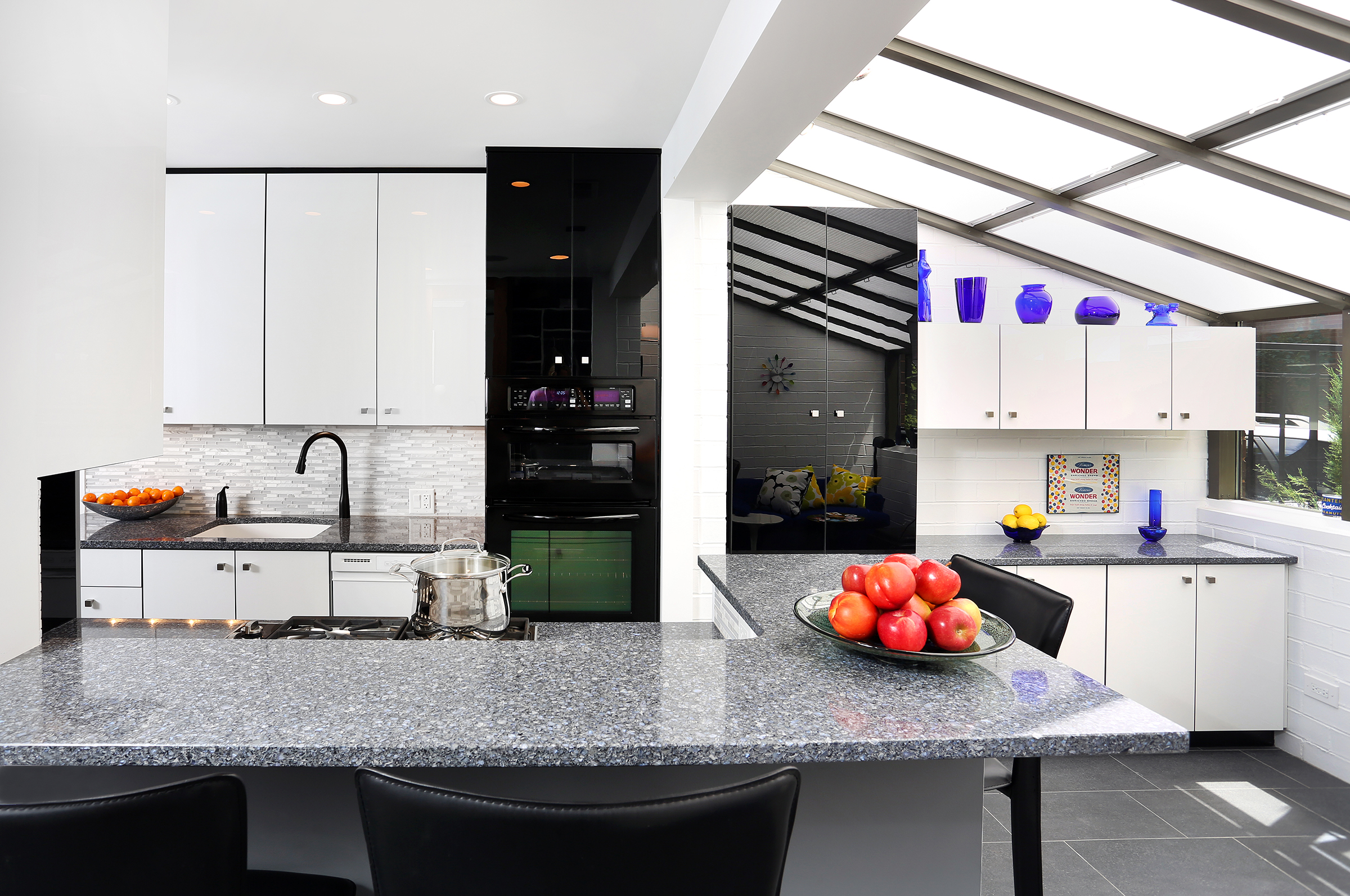 Black and white glossy in galley kitchen