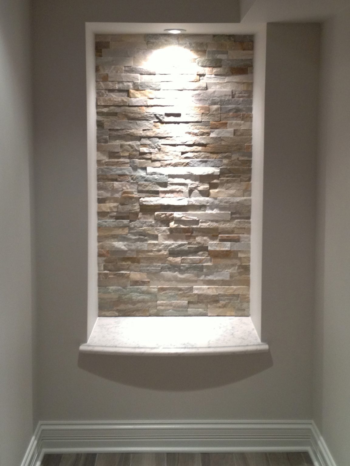 Washing the wall with light further enhances the beauty of ledger stone.