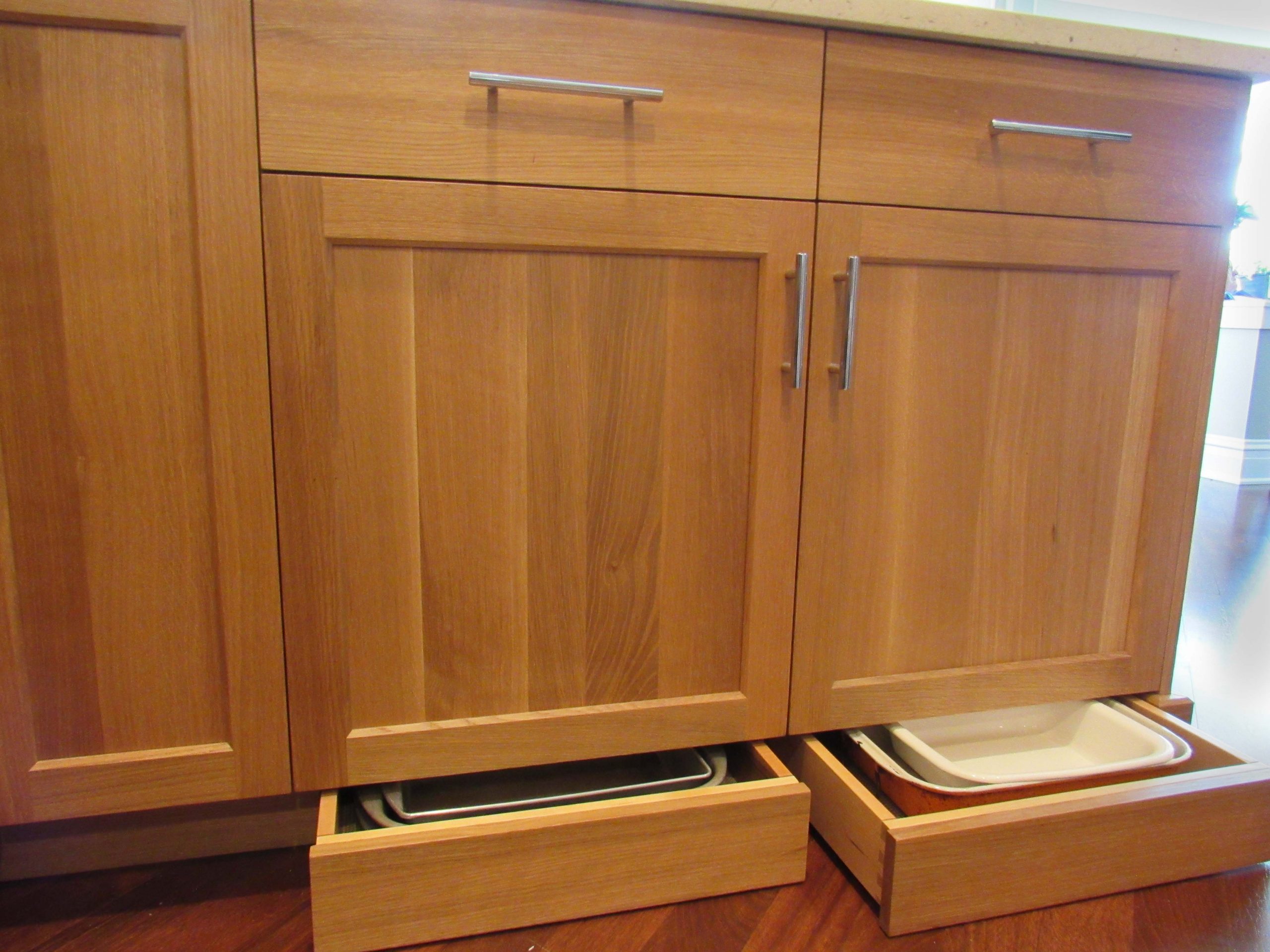 small drawer in the toe kick of a